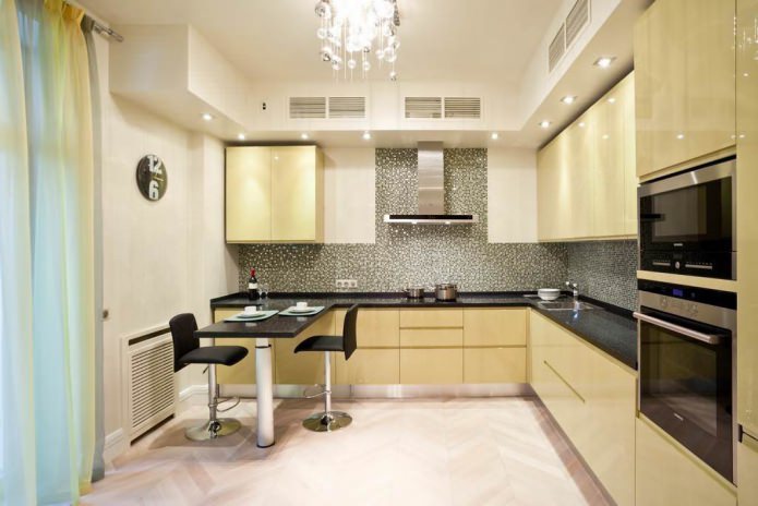 Design of a corner kitchen with a bar counter