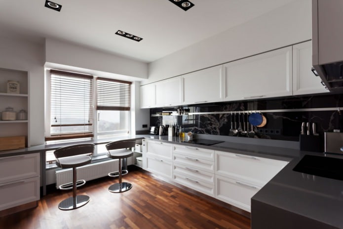 Kitchen with a bar counter by the window