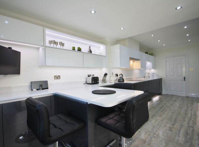 black and white kitchen with a bar counter