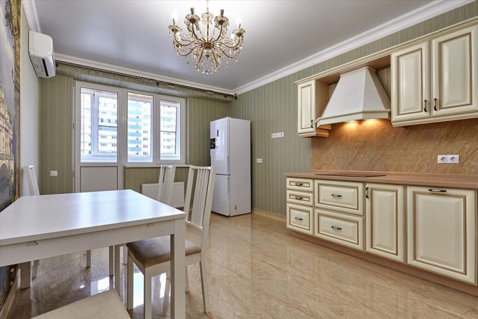 Green wallpaper in the kitchen in a classic style