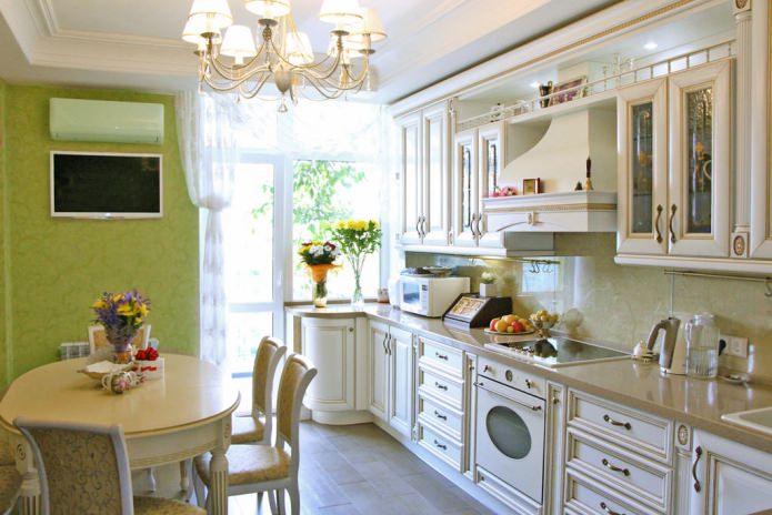Green wallpaper in the interior of the kitchen in the classic style