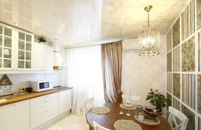 green wallpaper in the kitchen in the Provence style