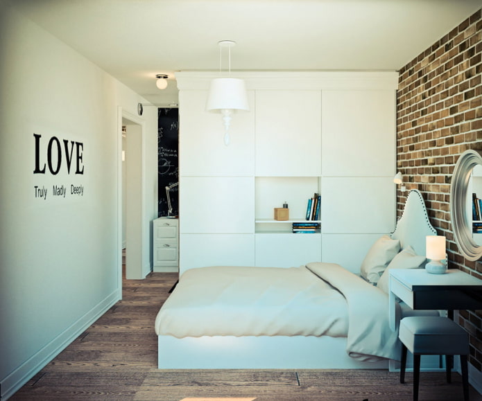 The room is zoned by a closet