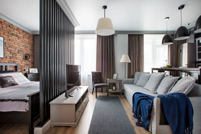 Studio with a bed behind a partition