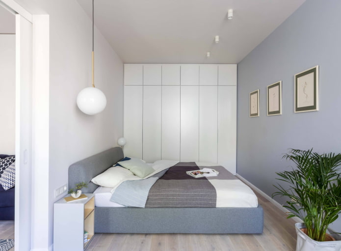 Bed and wardrobes along the entire wall