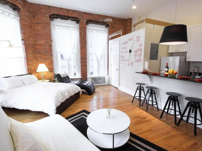 studio apartment interior with three windows