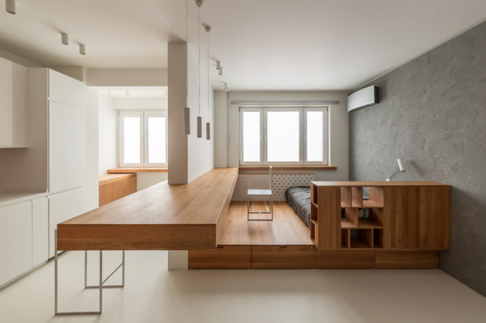 studio apartment interior with two windows
