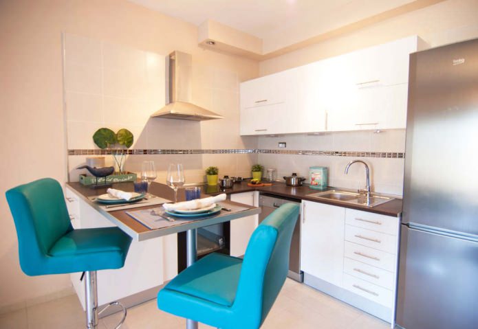 small corner kitchen with a bar counter