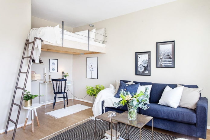 arrangement of furniture in a one-room apartment with a niche