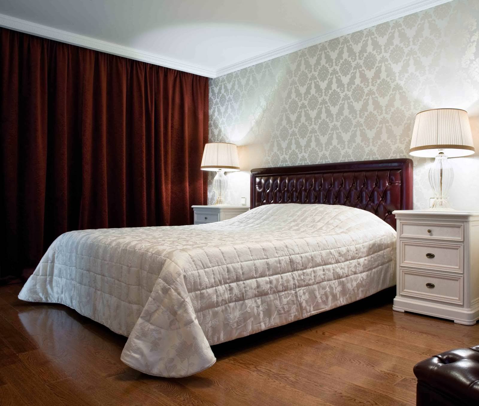 burgundy curtains in the design of the bedroom with gray wallpaper