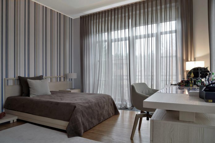 Curtains in the design of the bedroom with gray wallpaper