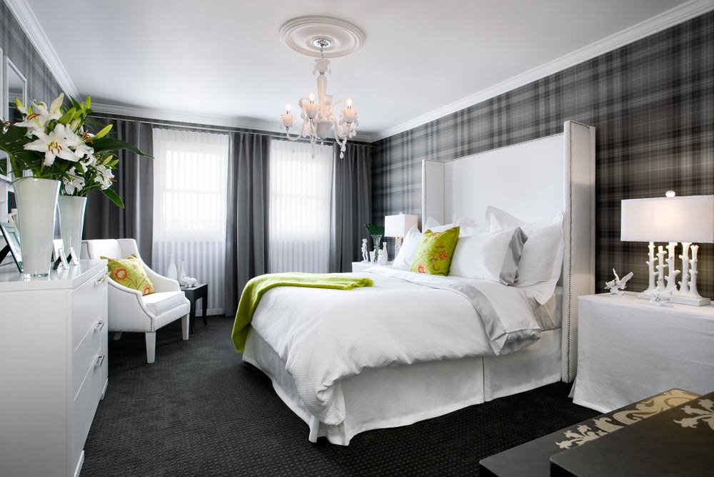 Curtains in the design of the bedroom with gray wallpaper