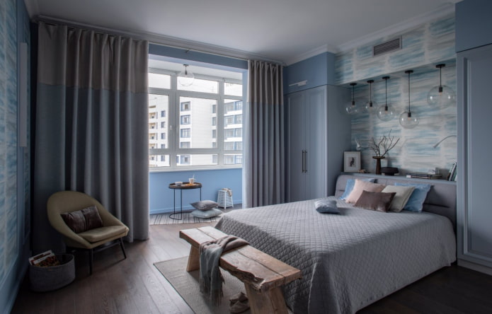 blue bedroom with a balcony