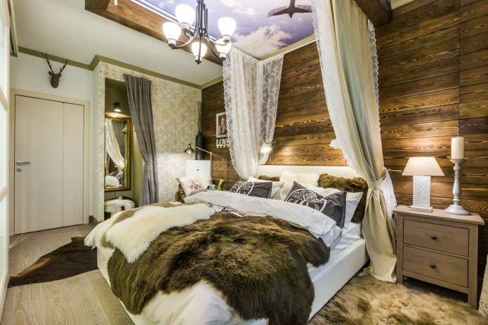 Bedroom with a wooden wall