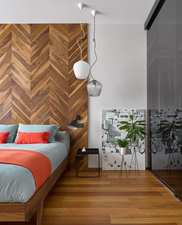 Bedroom with a wooden wall