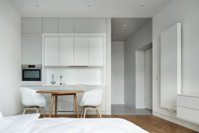 kitchen area in the interior of a studio apartment