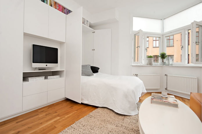 sleeping area in the interior of a studio apartment