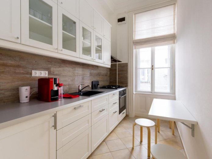 straight kitchen with dining table
