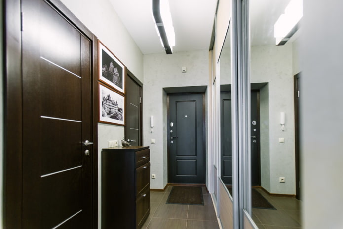 narrow hallway with a cabinet