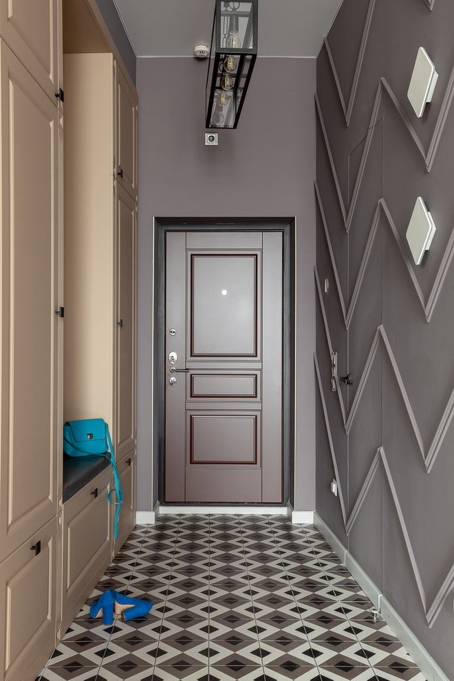 narrow hallway with brown walls and beige furniture