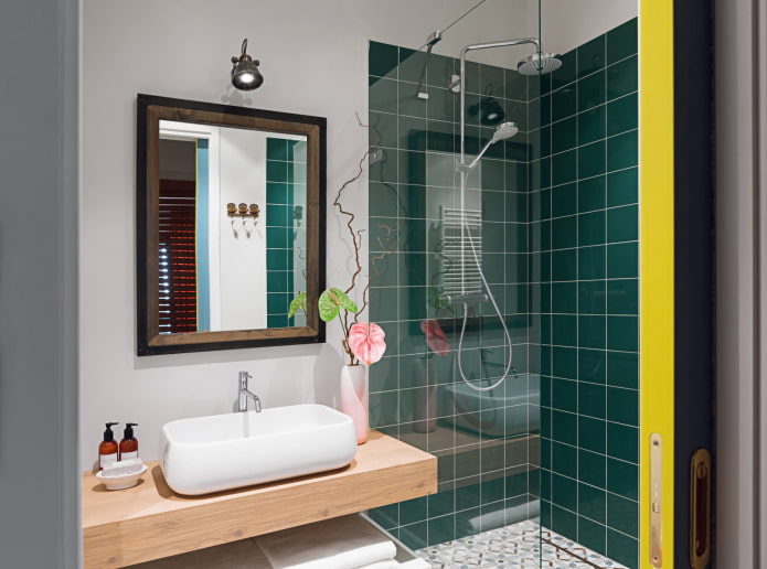 Glass cabin in a green bathroom