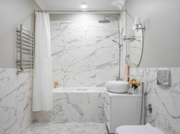 walls and floor in the bathroom, finished with the same tiles