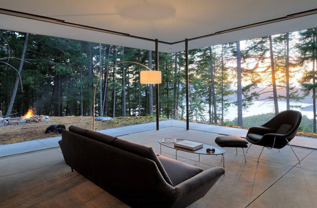 Living room interior in a country house with panoramic windows
