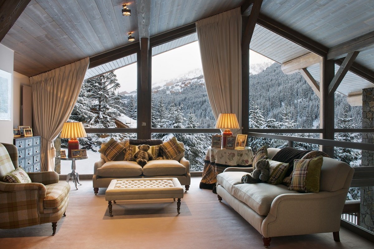 interior of the living room in a country house with panoramic windows