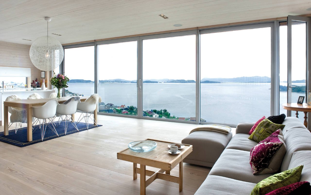 Living room interior in a country house with panoramic windows