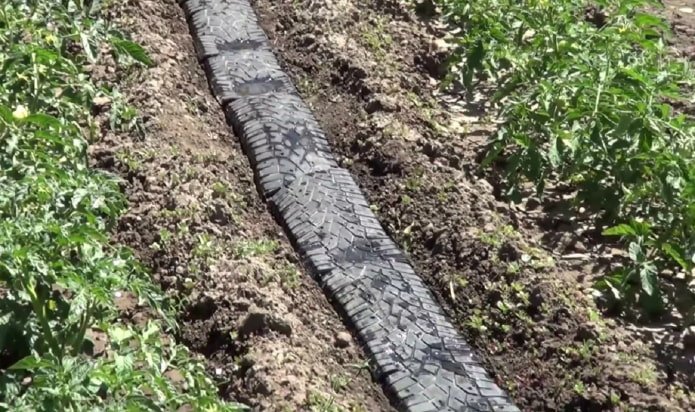 path between beds made of tires
