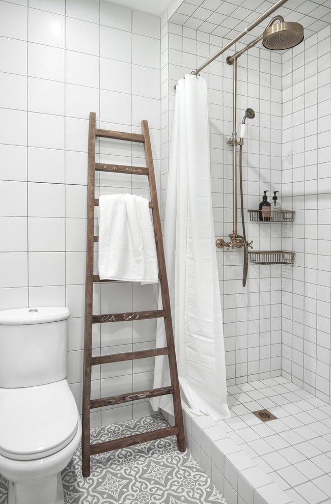 shower made of white tiles in the interior