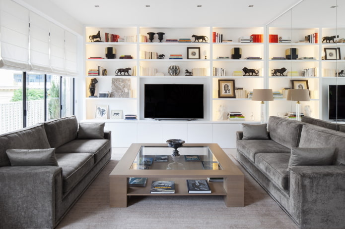 a pair of sofas in the hall