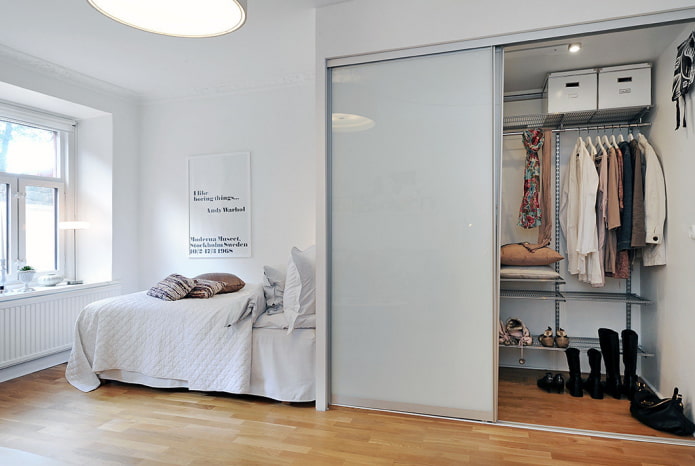 dressing room in a niche in the bedroom interior