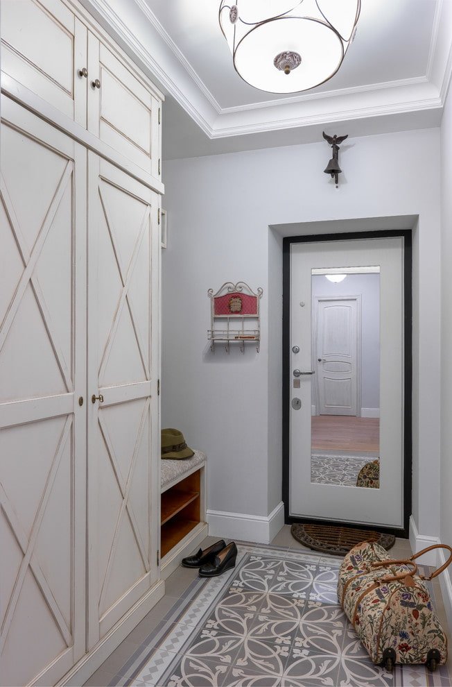 door with a mirror in the interior of the hallway
