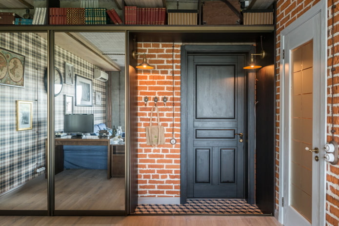 entrance door in the hallway in the loft style