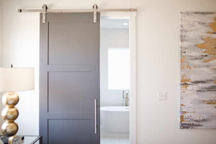 barn door to the bathroom