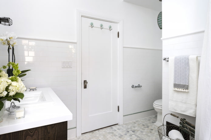 white bathroom with a door