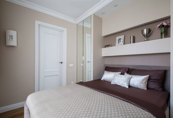 Bedroom with a mirrored wardrobe