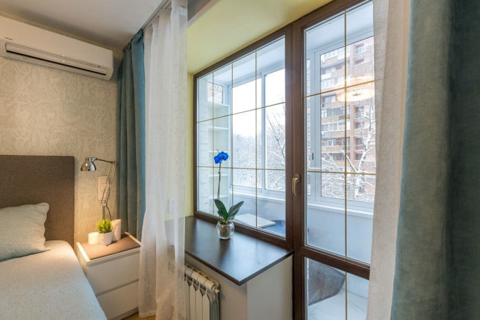 Bedroom in a room with a balcony