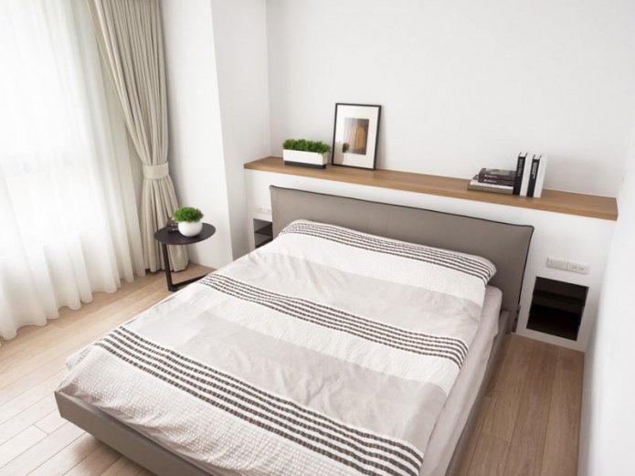 double model with a shelf in the headboard in the interior