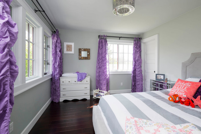 children's room with purple curtains
