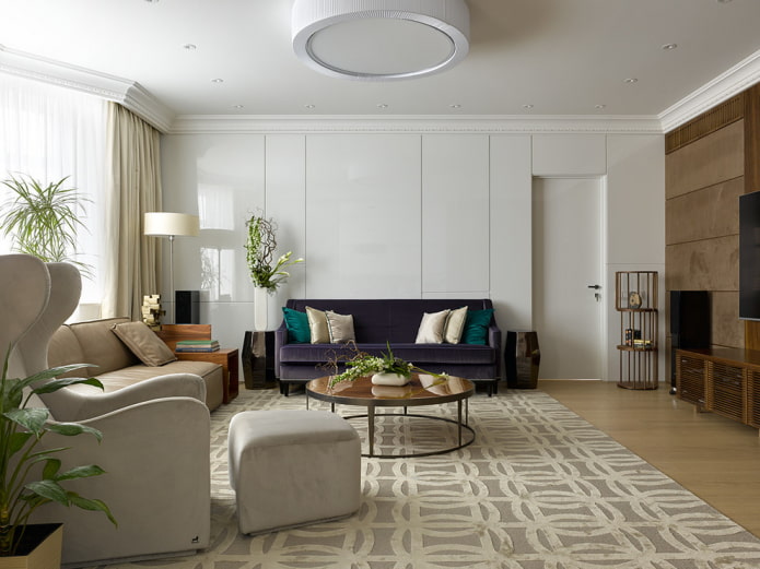 purple sofa with emerald pillows