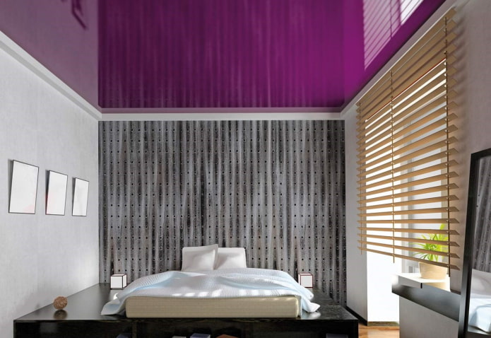 purple glossy stretch ceiling in the bedroom