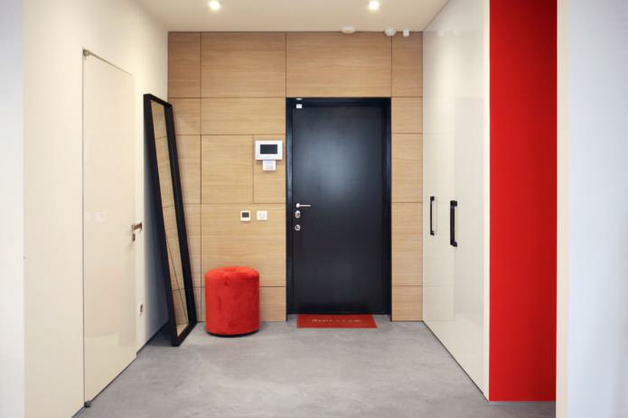 spacious hallway with red accents