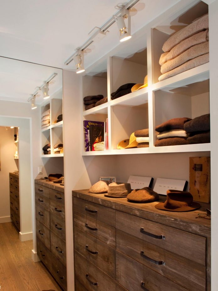 small walk-in closet with mirror