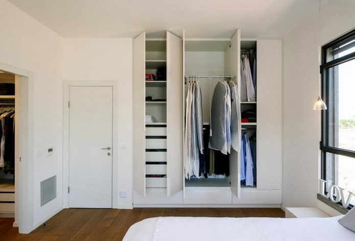 filling the wardrobe in the bedroom interior