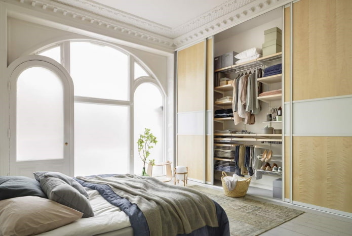 filling the wardrobe in the bedroom interior