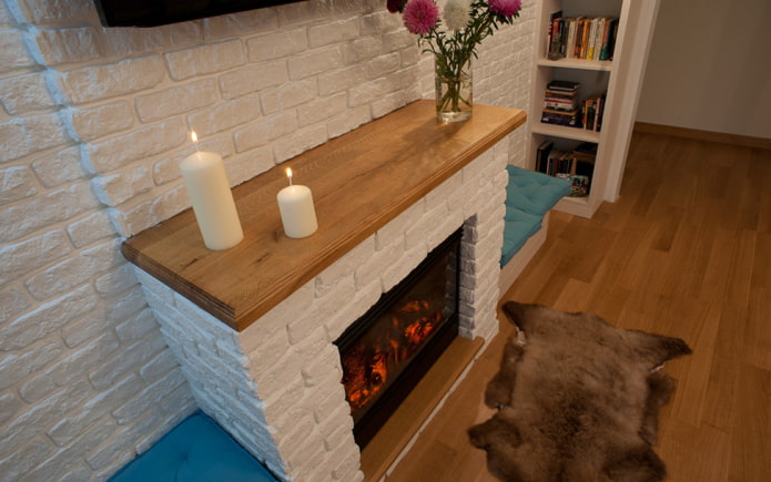 gypsum tiles in the design of the fireplace in the interior