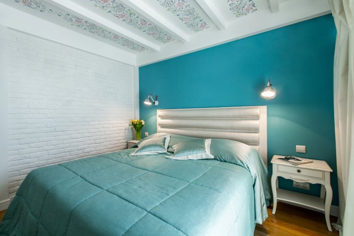 blue accent wall in the bedroom