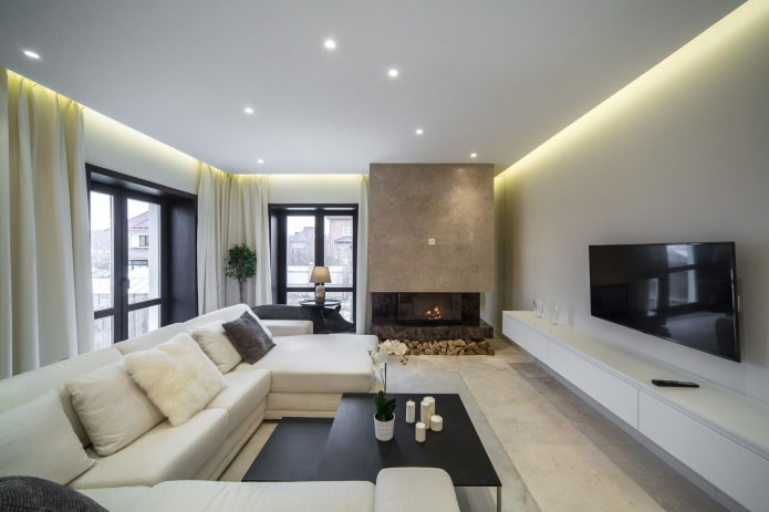 living room with a fireplace on the corner of the house